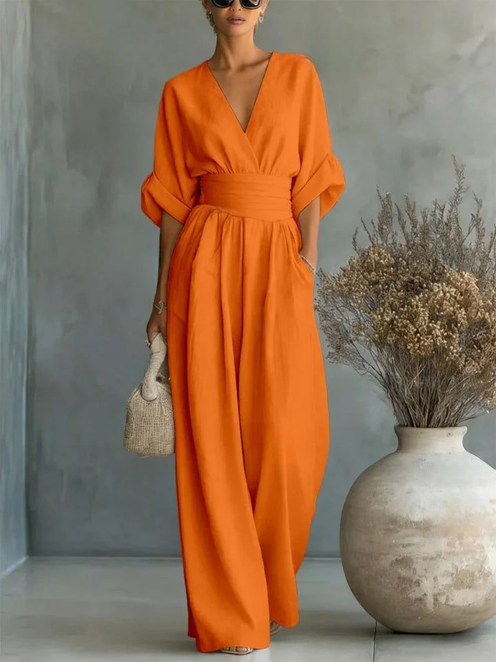 Elegante mono con escote en V, cintura alta y pierna ancha