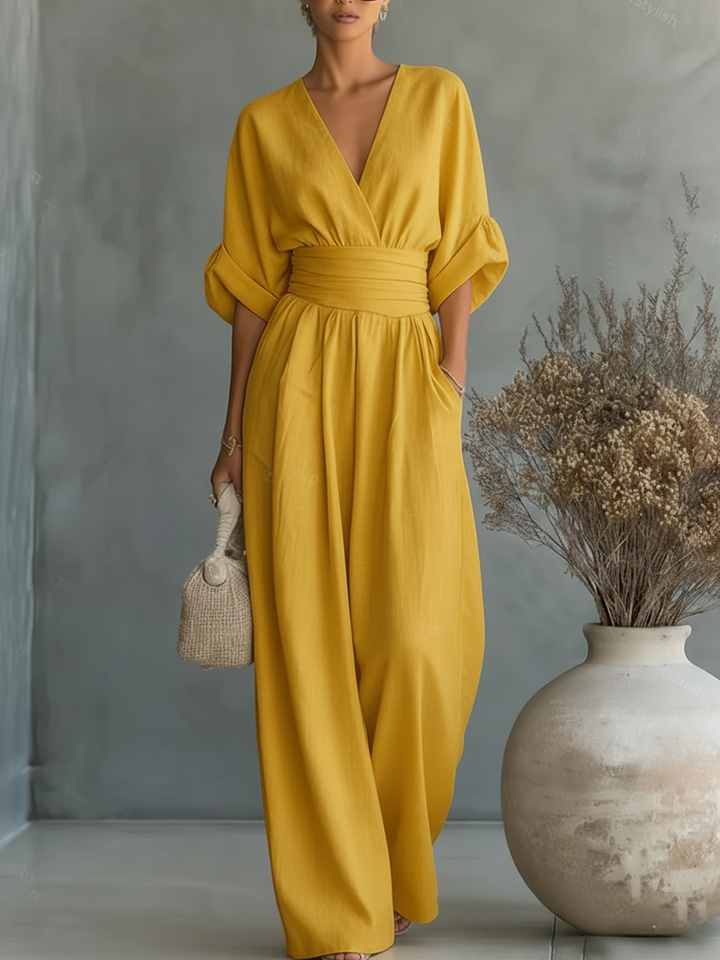 Elegante mono con escote en V, cintura alta y pierna ancha