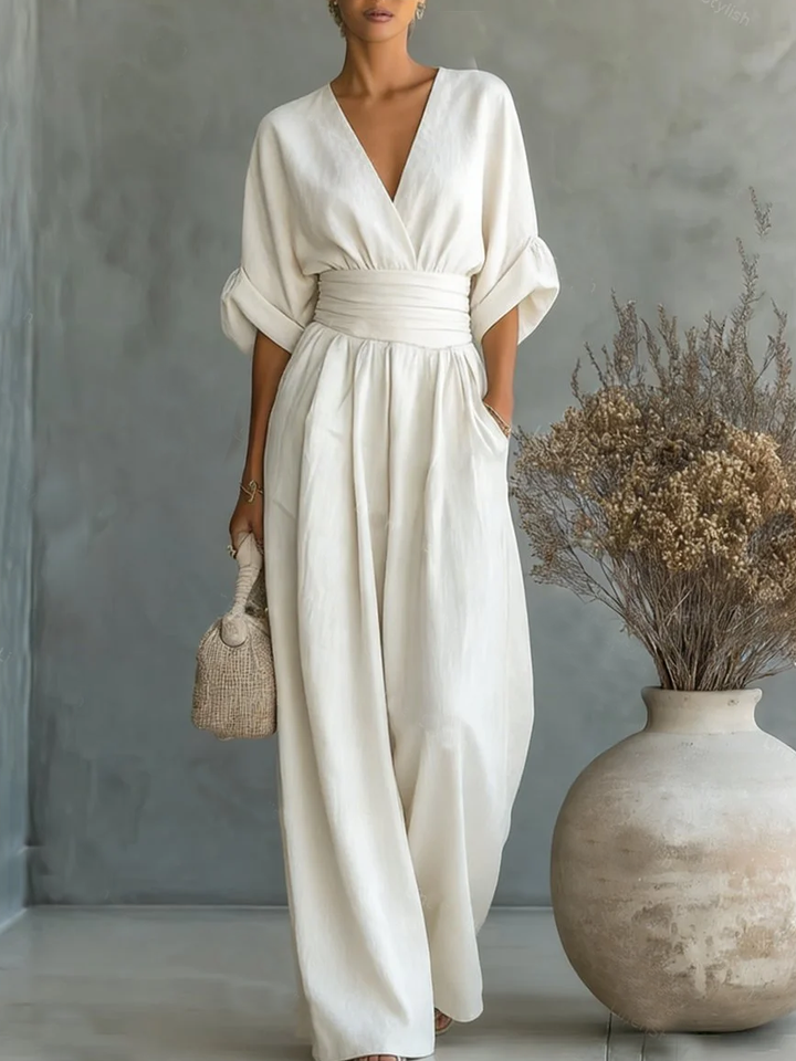 Elegante mono con escote en V, cintura alta y pierna ancha